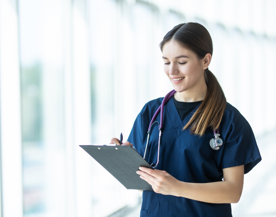 A nurse documenting patient info during an exam