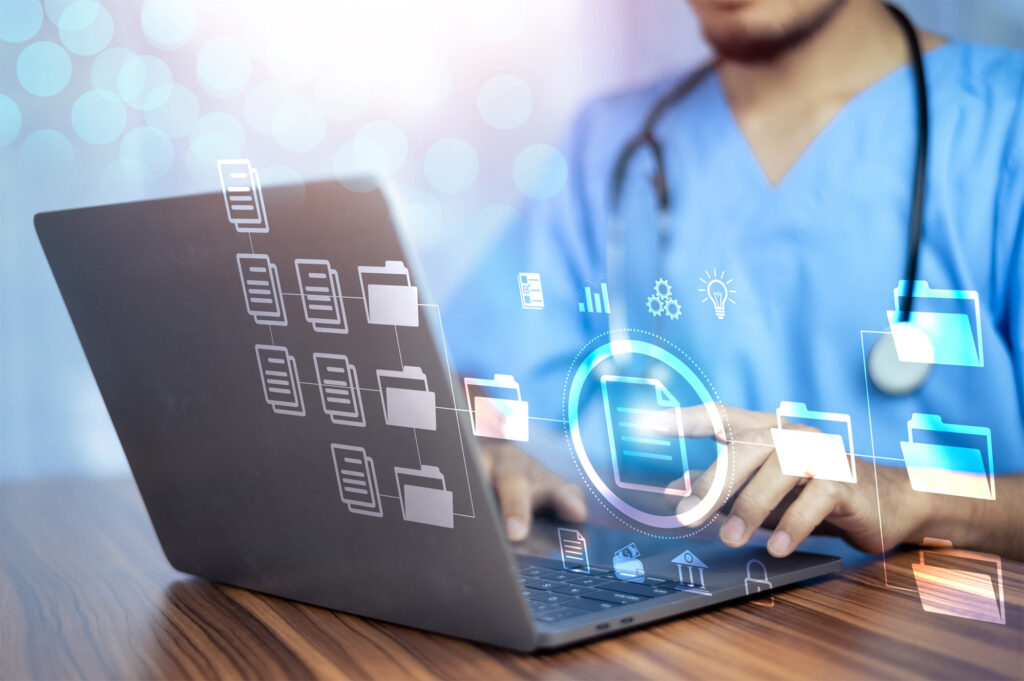 A doctor efficiently accessing medical information and managing patient records with laptop
